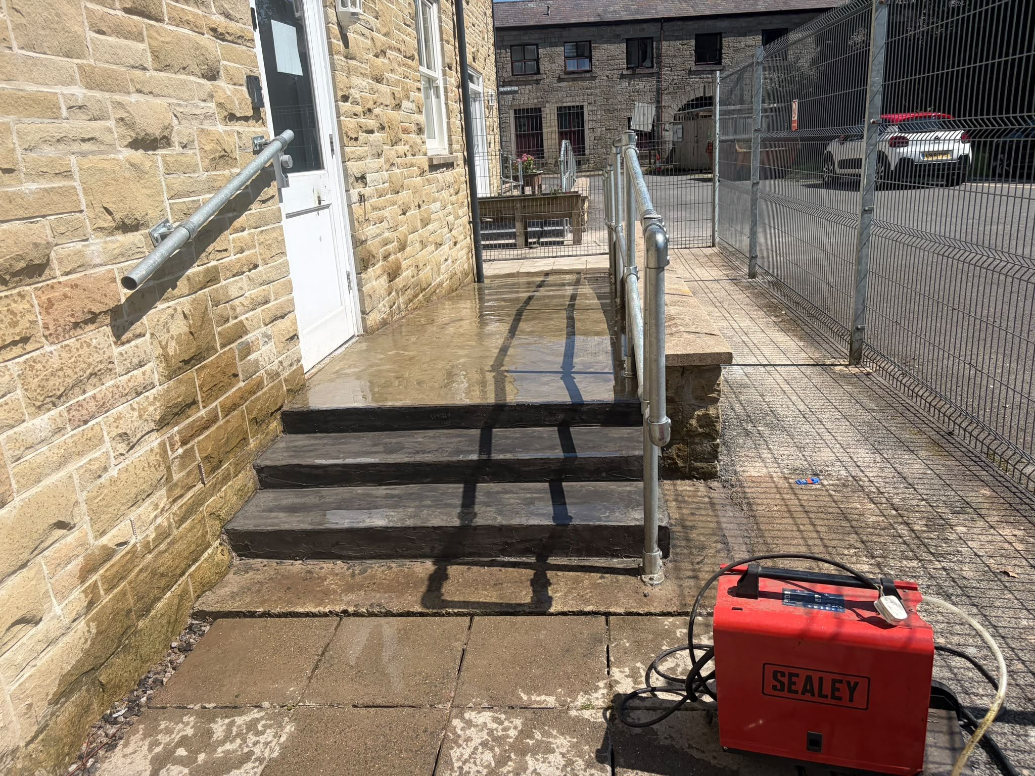 Completed entrance steps with handrails